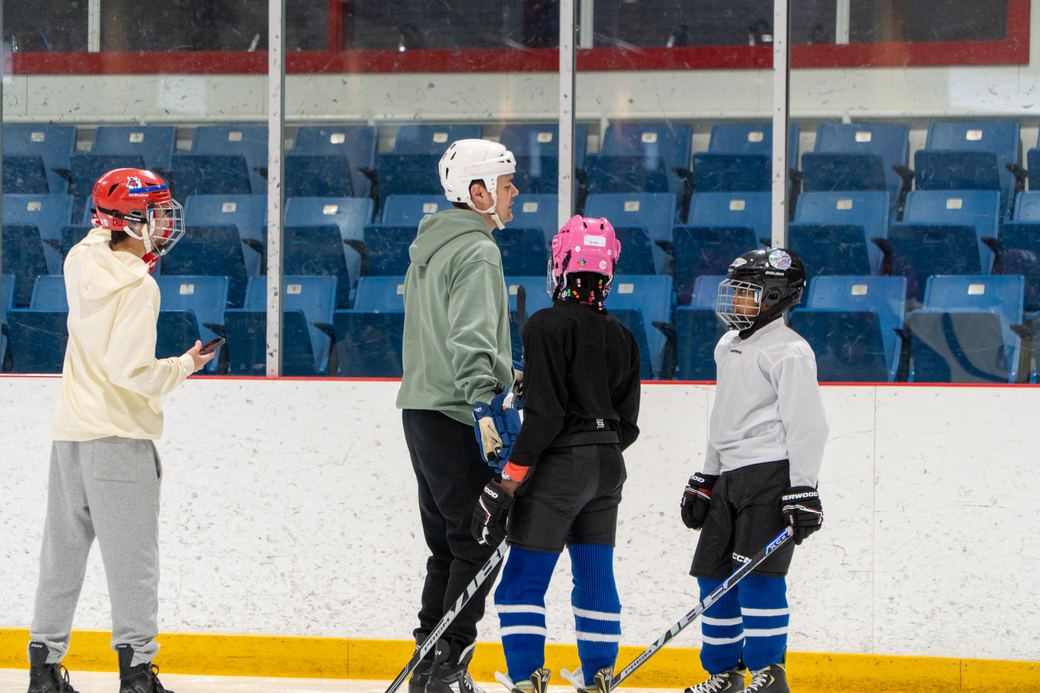 A group of campers gathered in a loose circle mid-session