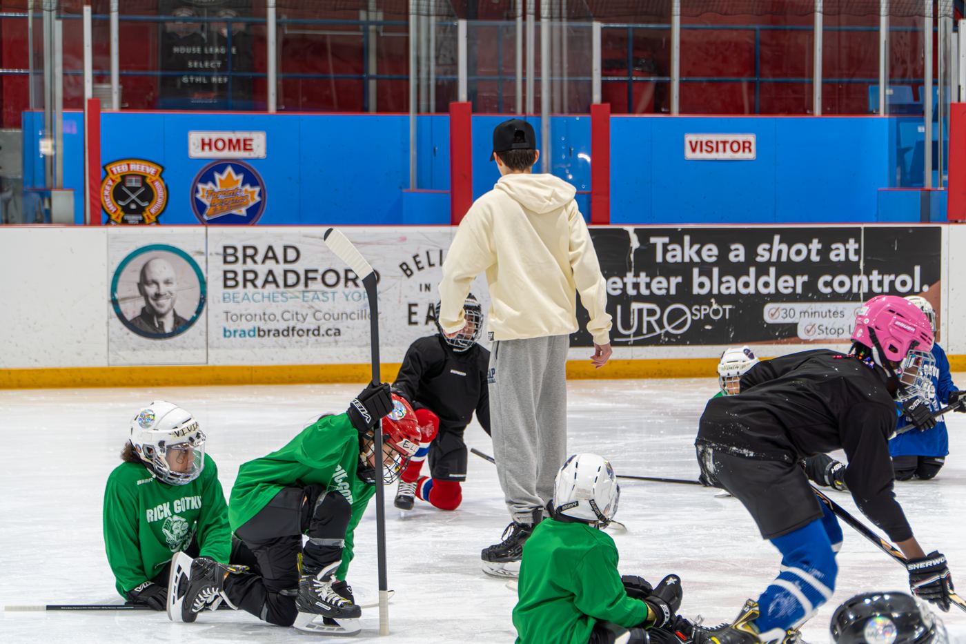 A large group of campers and volunteers spread across the ice