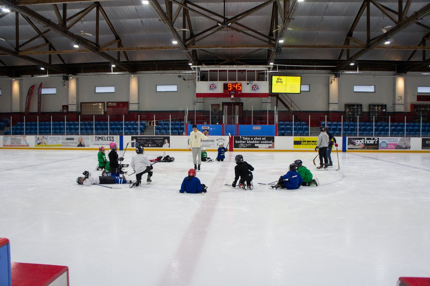 A wide view of the arena with campers spread across the ice