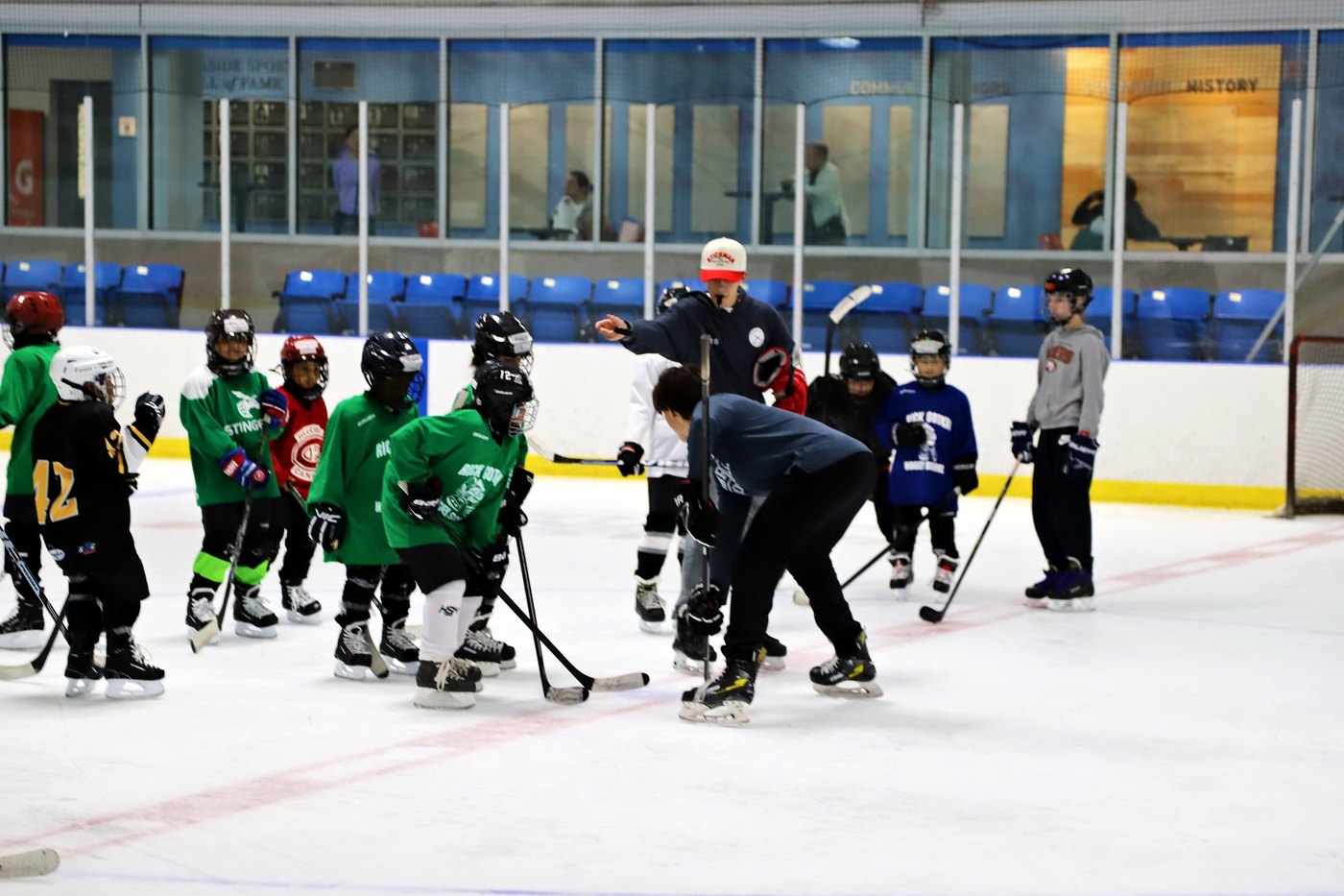 Campers and coaches spread across the ice at Leaside during Summer Camp 2026